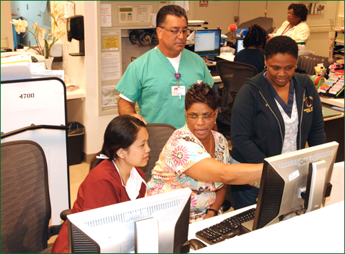 LAC+USC Medical Center clinical staff utilize an automated system to generate a medical consent form to review with a patient. Photo courtesy of LAC+USC Medical Center