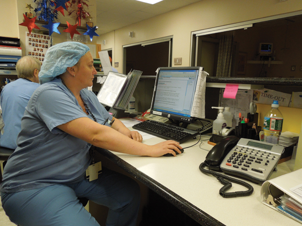 A general surgeon uses an automated informed consent application to prepare a new consent form to reflect changes in a planned surgical procedure. Photo courtesy of South Jersey Healthcare.