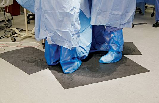 After (right): Absorbent mats quickly absorb liquids and stay flat to keep floors safer.
