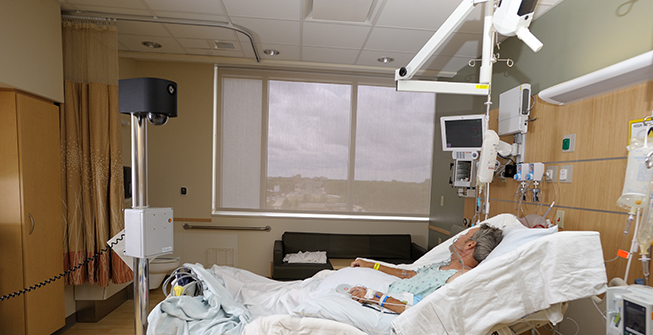 Virtual sitter technology installed on mobile cart and positioned at the foot of the patient’s bed.